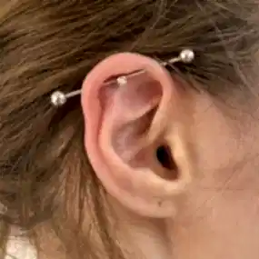 Пирсинг индастриал в Алматы